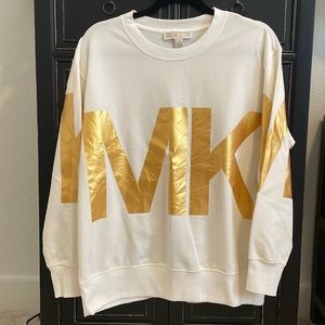 Michael Kors fashion basics top with large printed metallic gold MK emblems